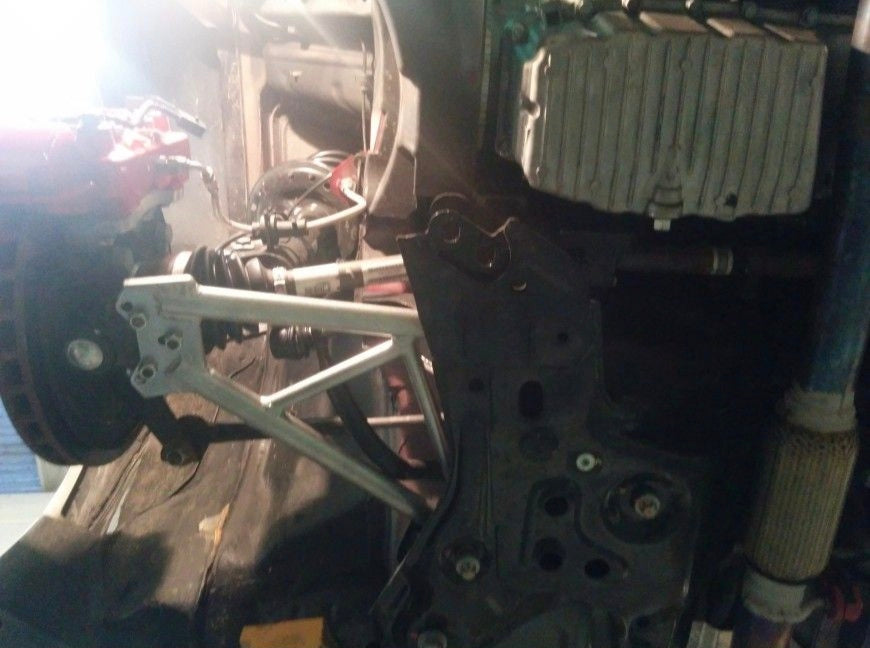 DNA Racing front trapezoid kit
